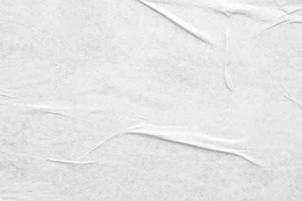 istock Blank white crumpled and creased paper poster texture background 1269200625