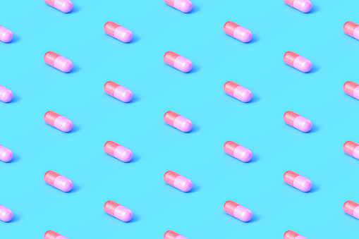 Seamless repetitive Capsule pills on blue background