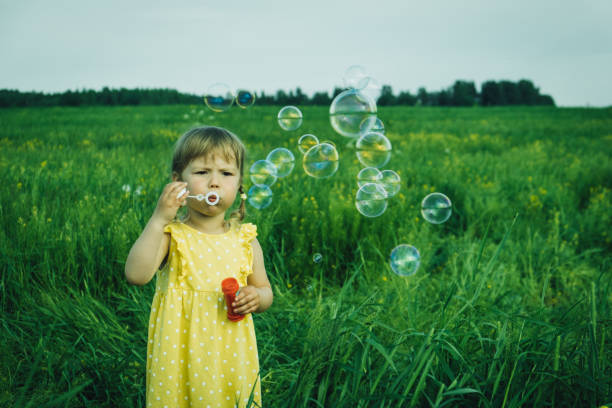 istock Girl walking on a field. 1269201330