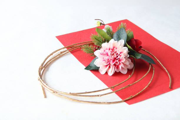 istock gold branch wreath --- red  and white Camellia 1269202377