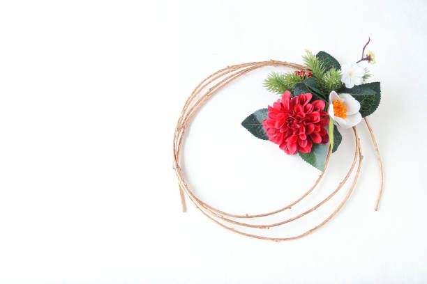 istock gold branch wreath --- red  and white Camellia 1269202395