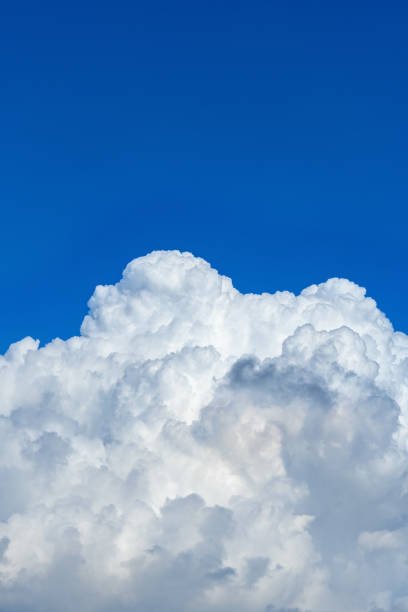 istock beautiful blue sky with thick white clouds in the morning vertical composition 1269203279