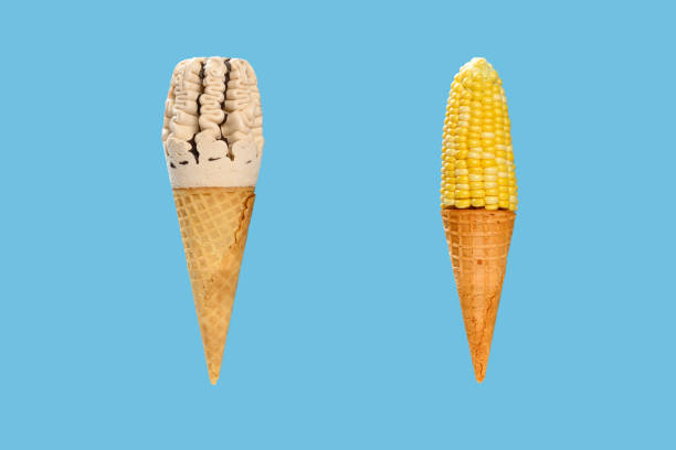 milk tea flavor ice cream cone with a similar look maize plus an empty cone on blue background concept of healthy eating ice cream cone