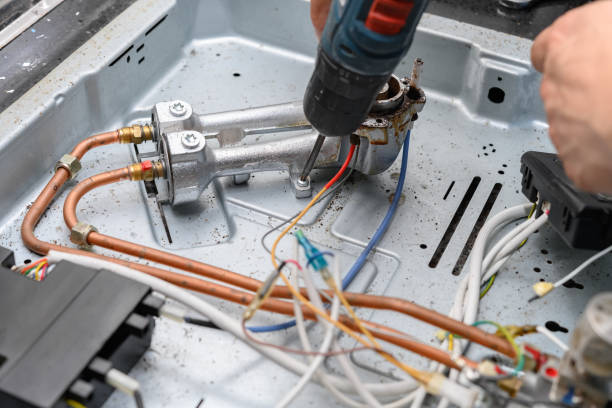 istock man fixing a gas cooker 1269206788