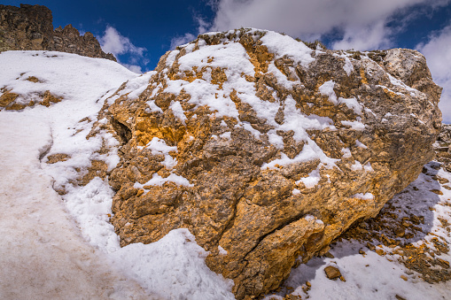 Snowcapped boulder detail - Dolomites alps – Gran Paradiso, Italy