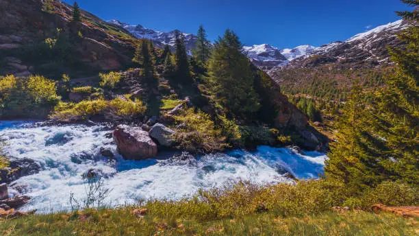 Waterfall stream to Monte Cevedale Palon de la Mare, Ortler massif and glacier – Lombardy, Italian alps