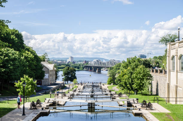 Lock of Rideau Canal in Ottawa during summer dayAlexandra bridge in background