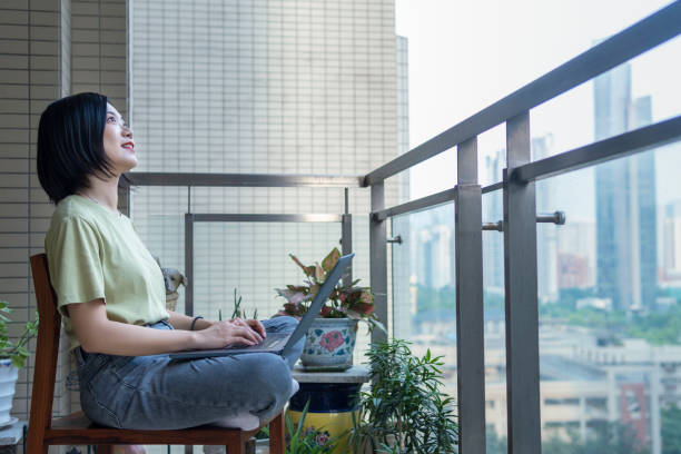 istock A freelancer works with a laptop on a balcony at home 1269214837