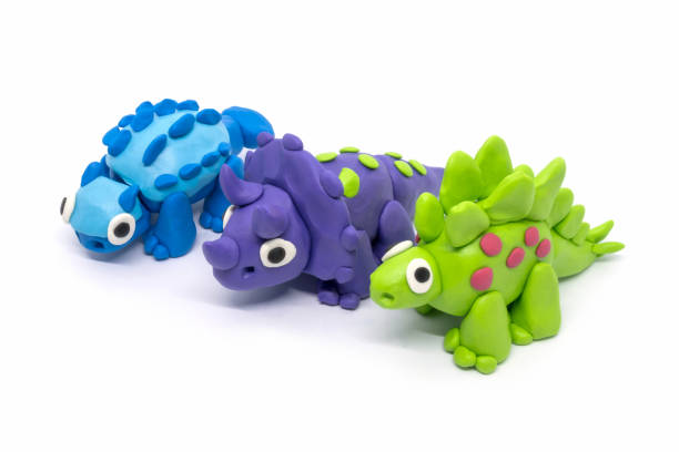 istock Play dough group Stegosaurus, Triceratopson, Ankylosaurus on white background 1269233648