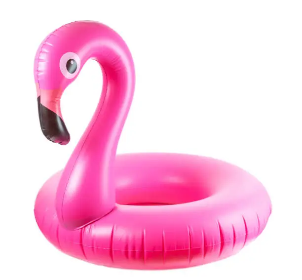Photo of Beach flamingo. Pink pool inflatable flamingo for summer beach isolated on white background. Trendy summer concept.