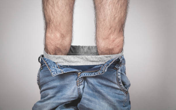 istock Caucasian man with pants down. 1269235829