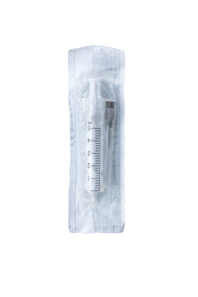 istock disposable plastic syringe with needle in the package on a white background 1269236058