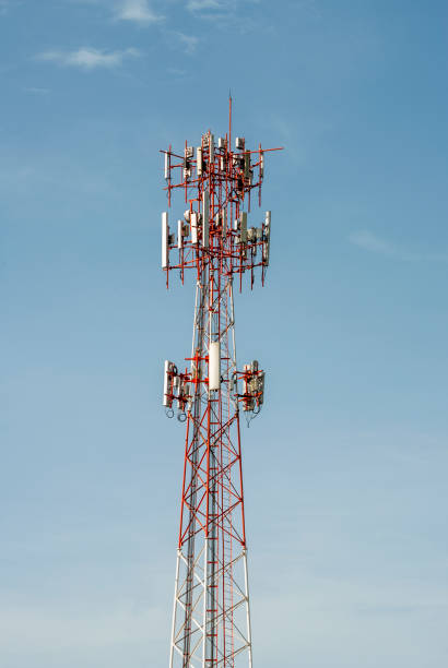 istock Telecommunication tower illuminated with natural light outdoors with blue sky. 1269236108