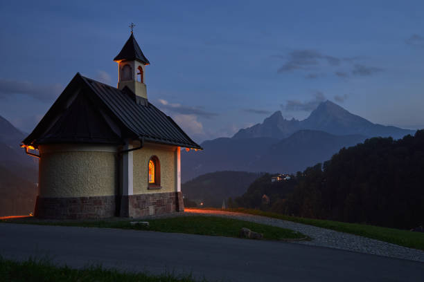 istock Illuminated Kirchleitn chapel and Watzmann mountain on summer evening in Berchtesgaden 1269240219