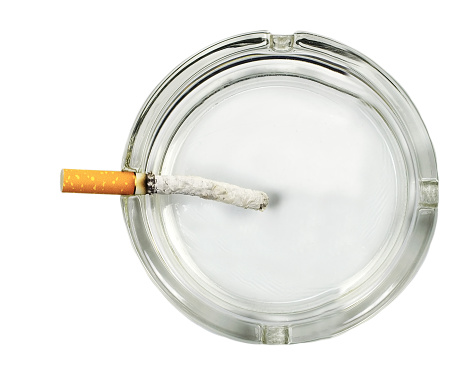 ashtray of cigarettes butts close-up