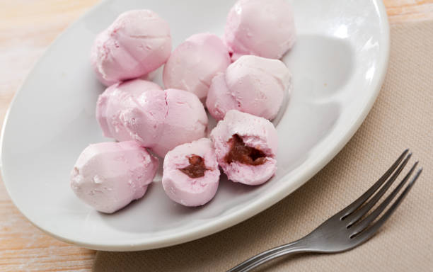 istock Balls of goat cheese with raspberries 1269246428