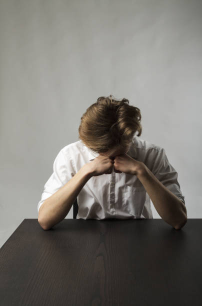 istock Tired young man. Overtime and fatigue concept. 1269249890