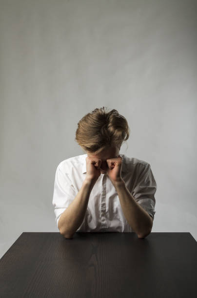 istock Tired young man. Overtime and fatigue concept. 1269249893