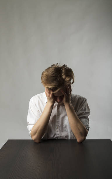 istock Tired young man. Overtime and fatigue concept. 1269249898