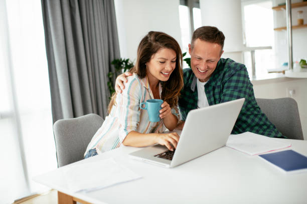 istock Husband and wife preparing bills to pay. 1269249938