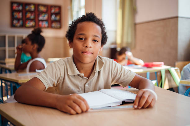 istock Portrait of smiling schoolboy 1269251733