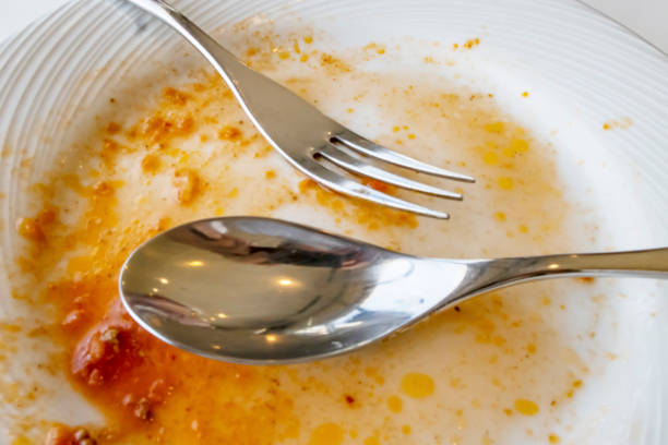 istock spoon and fork on a plate after meals 1269256924