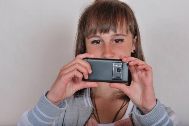 istock Girl with a mobile phone 1269257357