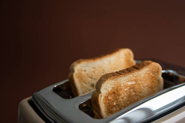istock Two roasted pieces of bread on toaster 1269258237