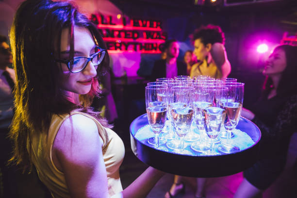 istock Waitress with champagne glasses 1269264208