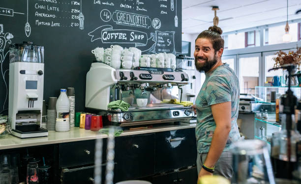istock Male barista preparing coffee machine 1269264574