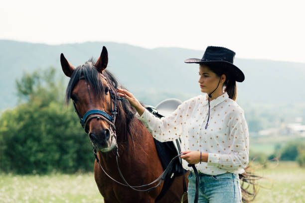 istock Young women rides a horse 1269265513