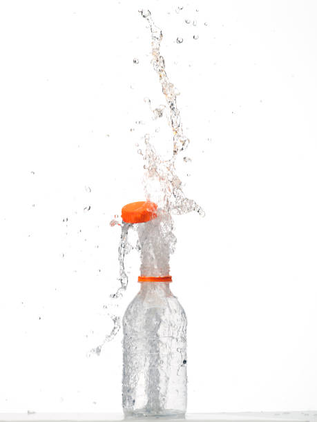 istock Water in glass bottle splashing 1269270553