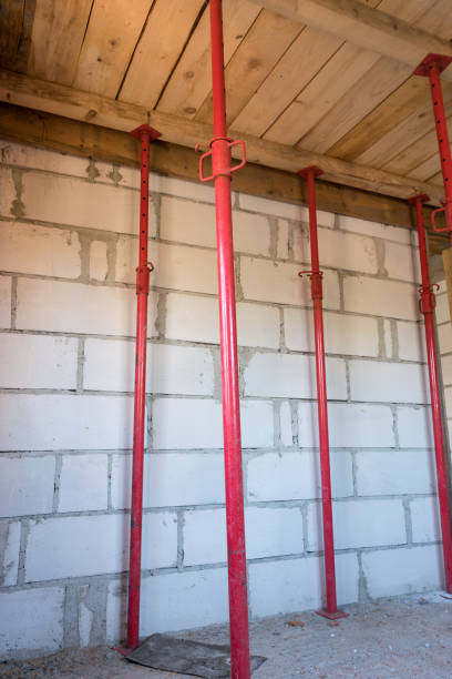 house under construction - installed props for pouring the concrete slab