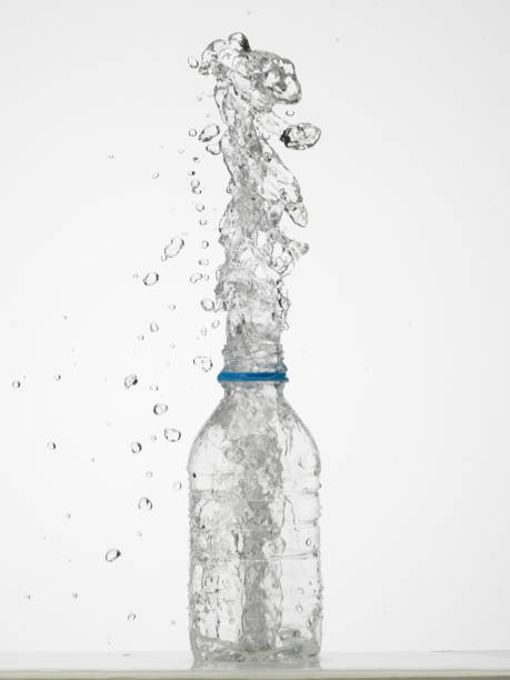 istock Water in glass bottle splashing 1269271319