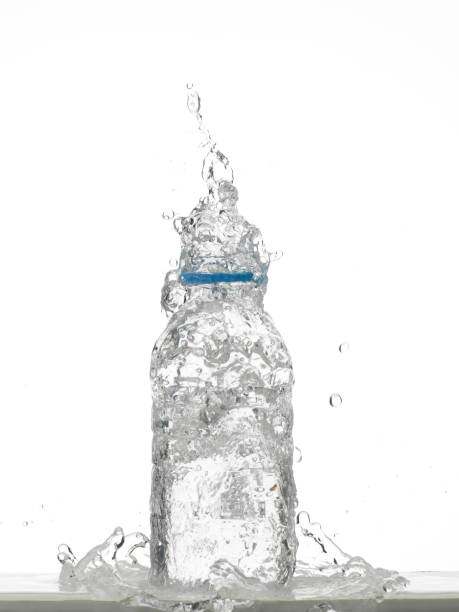 istock Water in glass bottle splashing 1269271331