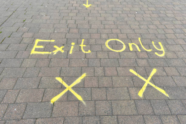 istock Exit only and x yellow mark sign on brick path leading to school ready for reopening of schools 1269273333