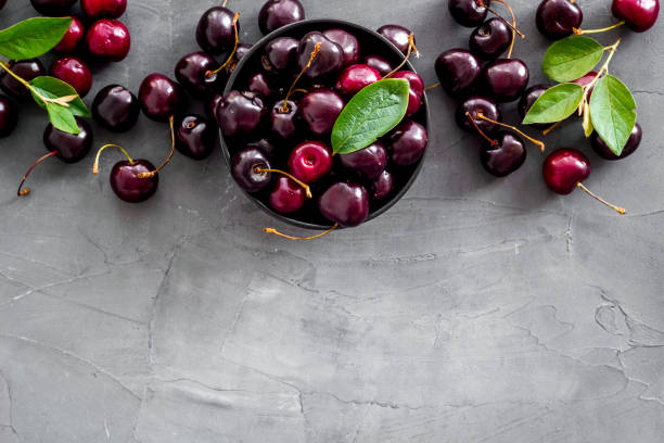 istock Berries in the bowl. Red cherry top view, copy space 1269281046