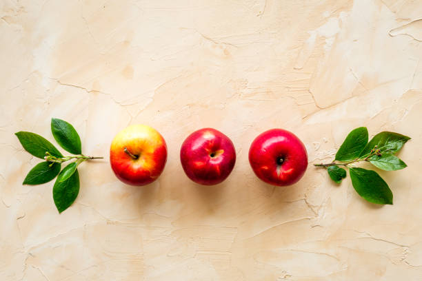 istock Ripe red apples with leaves - top view, copy space 1269282779