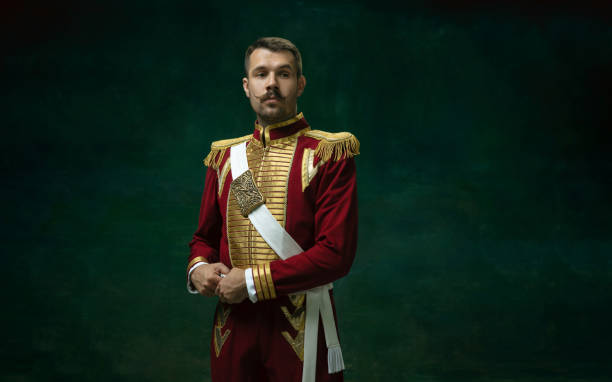 young man as nicholas ii on dark green background. retro style, comparison of eras concept. - majestade imagens e fotografias de stock