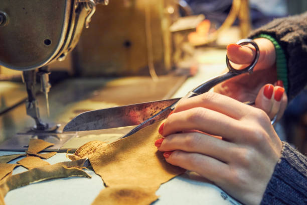 istock Woman tailor using retro sewing machine at home, hobby concept. 1269291552