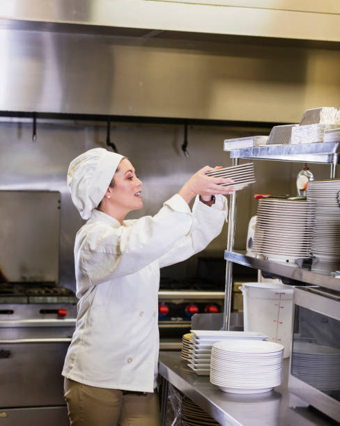 istock Hispanic female chef in restaurant kitchen 1269293054