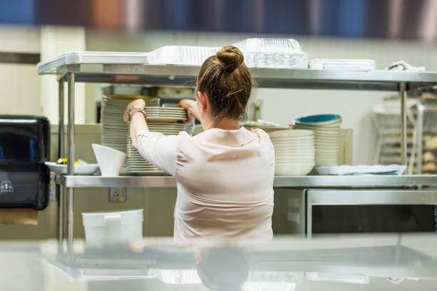 istock Hispanic woman working in restaurant 1269293256