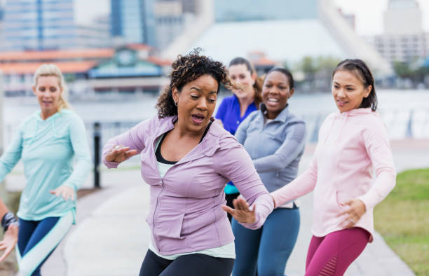 istock Multi-ethnic group of women taking dance exercise class 1269295120