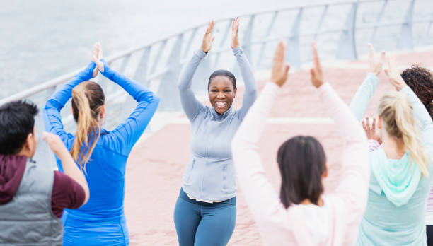 istock African-American woman leading dance exercise class 1269296378