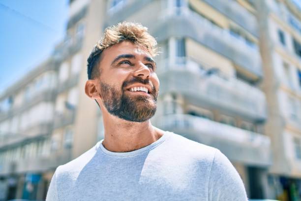 istock Young hispanic man smiling happy walking at the city 1269296500