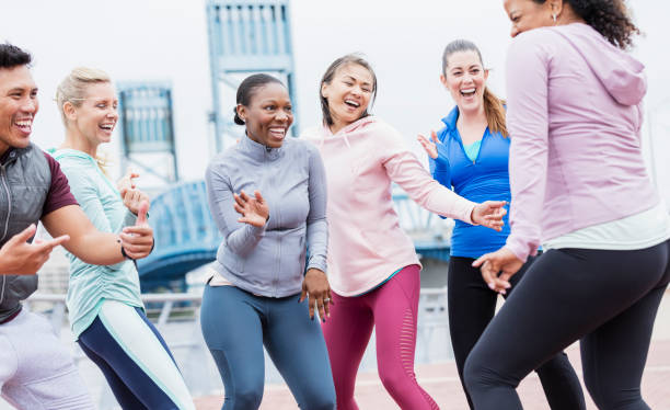 istock Multi-ethnic group of adults dancing outdoors 1269301287