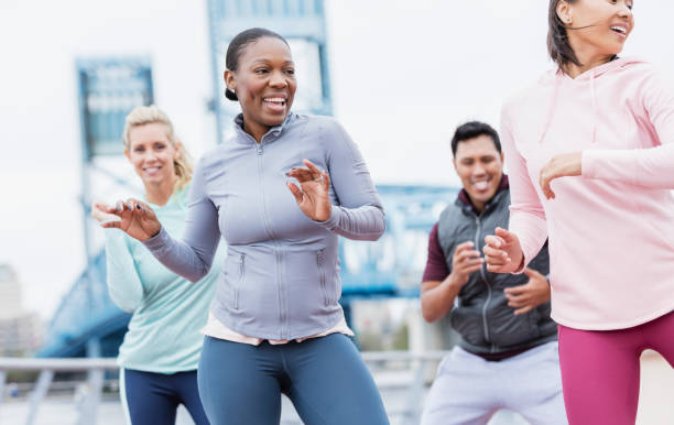 istock Multi-ethnic group of adults dancing outdoors 1269301898