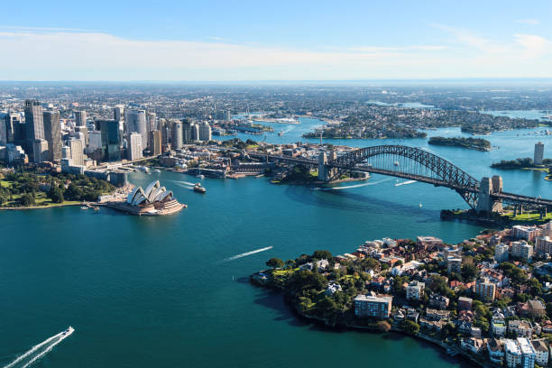 Aerial View of Sydney Harbour in Sydney, Australia Aerial view of Sydney Harbour featuring the Sydney Opera House and Sydney Harbour Bridge. opera house stock pictures, royalty-free photos & images