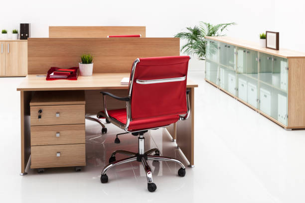 istock armchair, table and bookcase on a white wall 1269306651