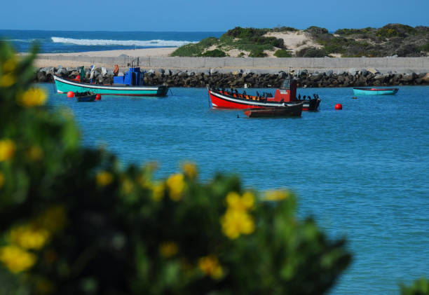 Color fishing boats waiting in the harbor for better weather